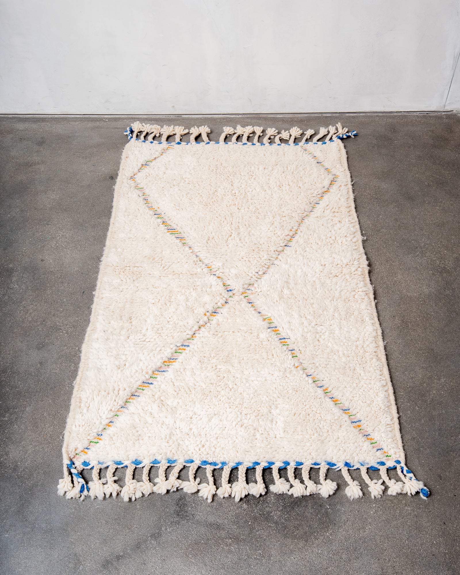 Modern, designer, handcrafted Berber rug from Morocco. Beniourain carpet with beautiful colours and patterns and fluffy wool texture.